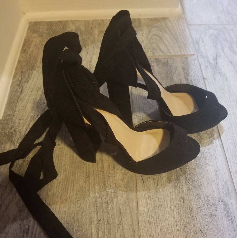 High black shoes ties around